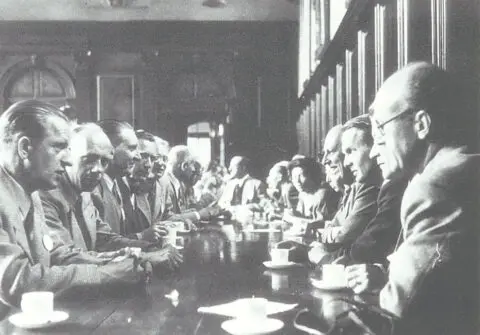 Historic founding meeting of IFLA Europe in Cambridge, showing landscape architects gathered around a conference table during discussions that led to the establishment of the organisation.